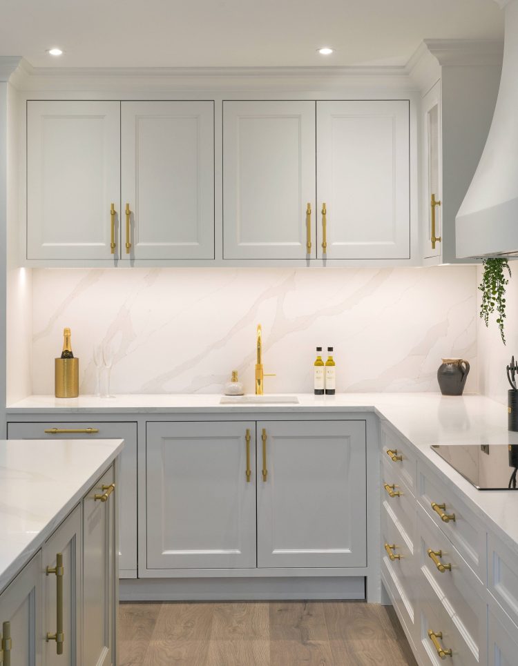 White kitchen with gold handles & tap