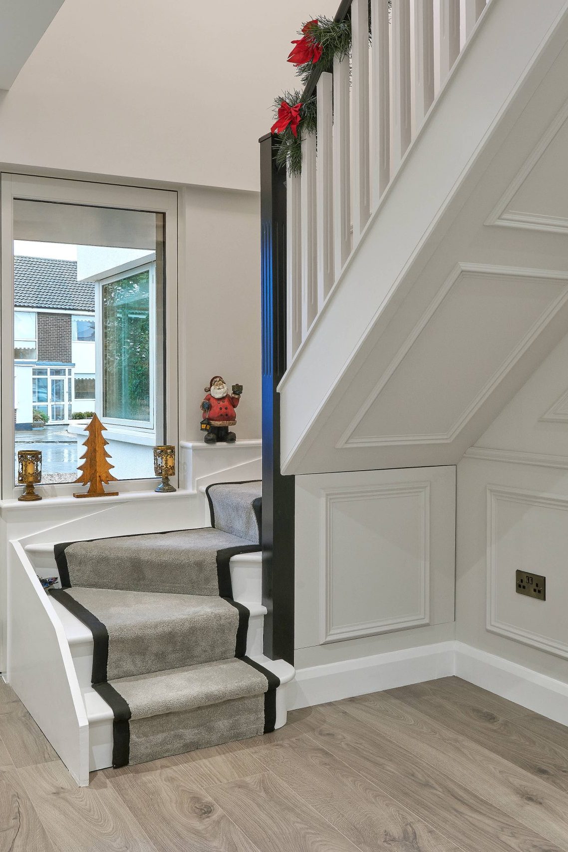 Hallway leading to front door & staircase