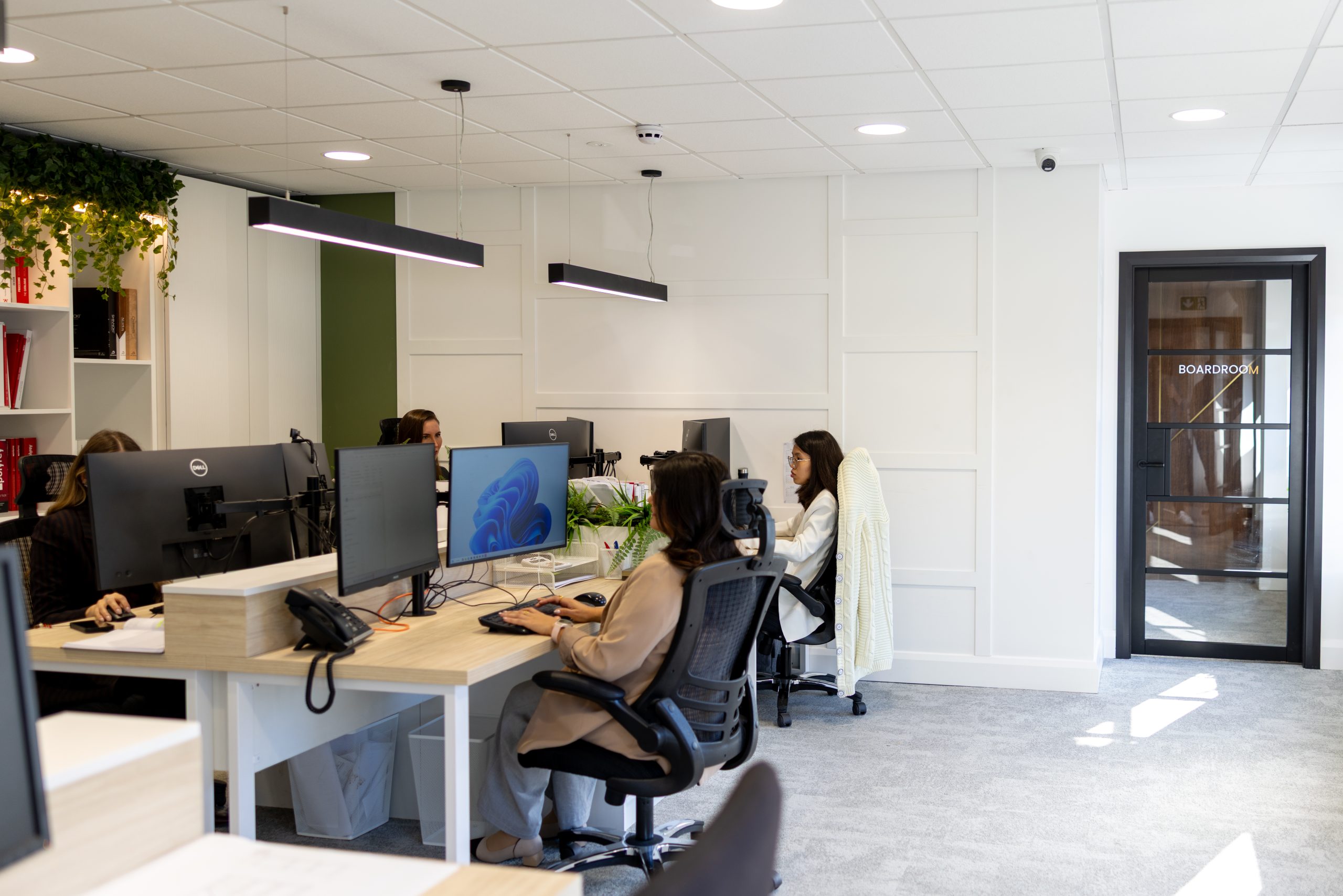 The ONOVO design team working at desks in their modern Dublin studio